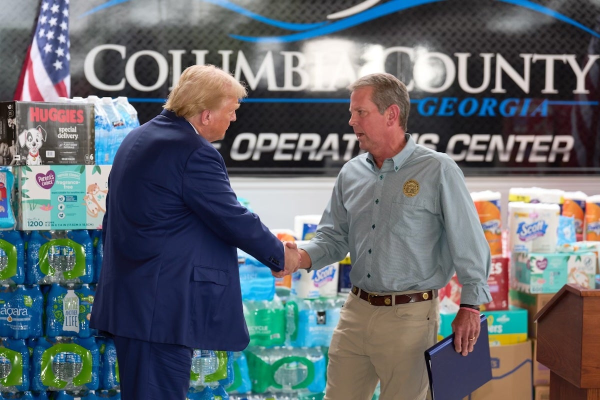 Brian Kemp and Donald Trump shake hands