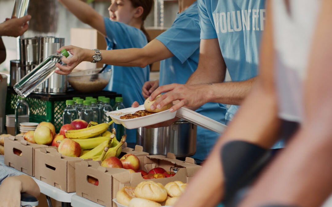 Volunteers prepare supply boxes to hand out to hungry residents. Photo iStockphoto