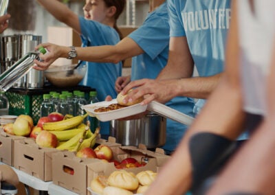 Volunteers prepare supply boxes to hand out to hungry residents. Photo iStockphoto