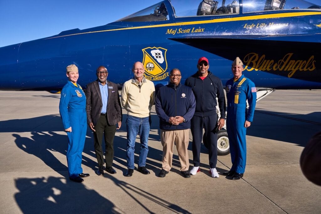 Major Scott Laux and Lt. Commander Lilly Montana, with the Blue Angels, posed with Benish Brown, Mayor Garnett Johnson, Randy Sasser, with the Augusta Aviation Commission, Commissioner-elect Don Clark during their visit to Augusta on Thursday, Nov. 21. Staff photo by Sanjeev Singhal