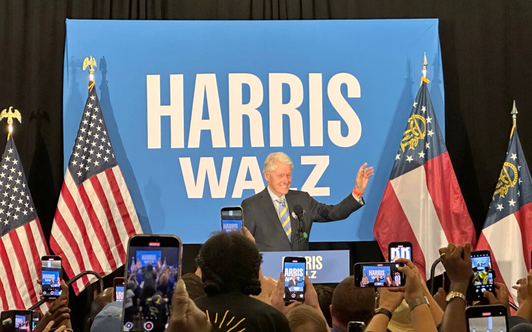 Bill Clinton waves to the crowd at a Sunday rally in Augusta. Staff photo by Susan McCord