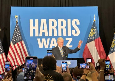 Bill Clinton waves to the crowd at a Sunday rally in Augusta. Staff photo by Susan McCord