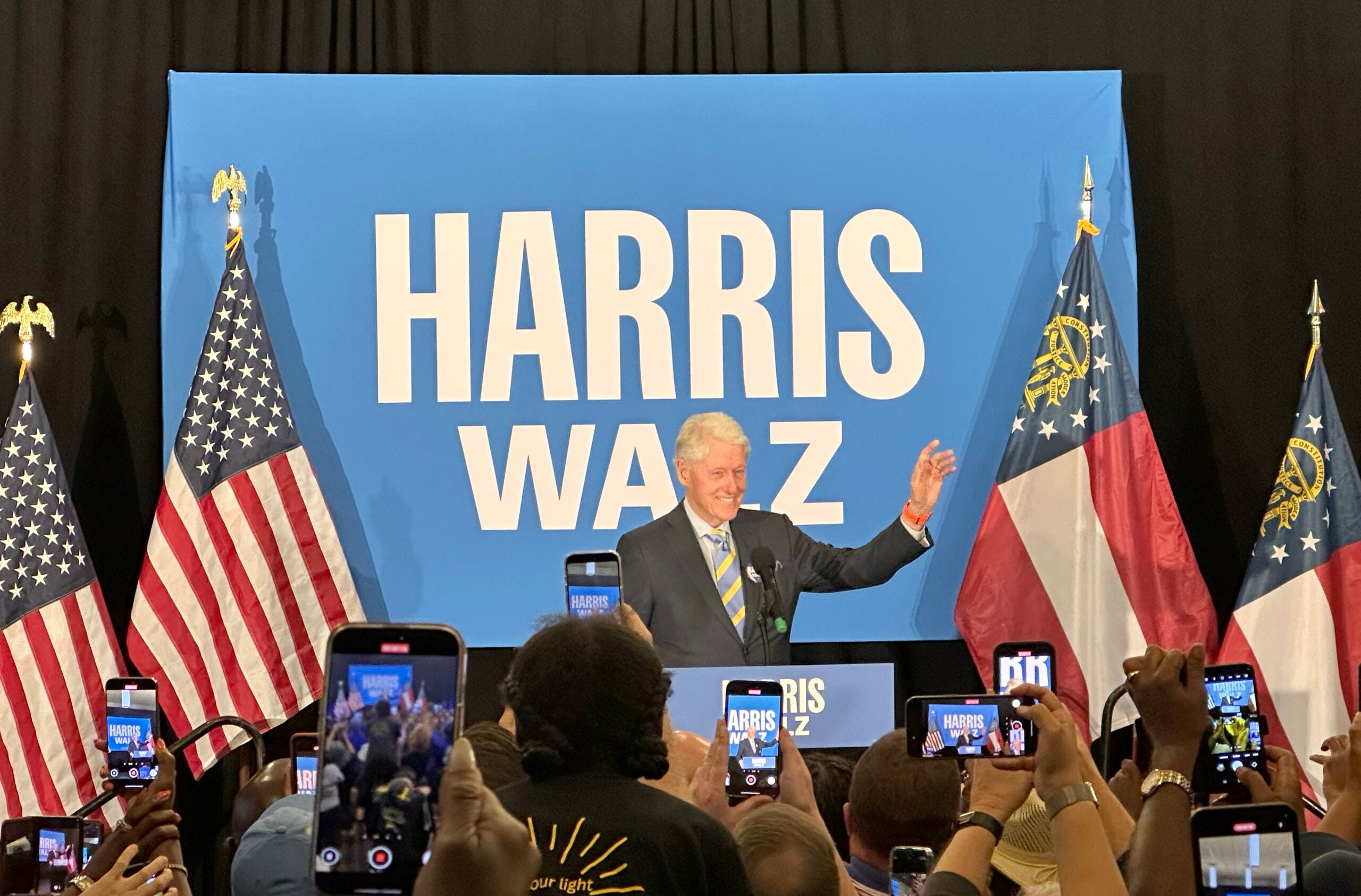 Bill Clinton waves to the crowd at a Sunday rally in Augusta. Staff photo by Susan McCord