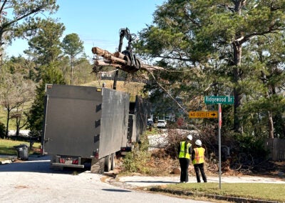 A debris truck removes trees from Sandy Ridge Place Nov. 13, 2024. Sept. 27 was the one-year anniversary of Hurricane Helene's strike on Augusta. Staff photo by Susan McCord