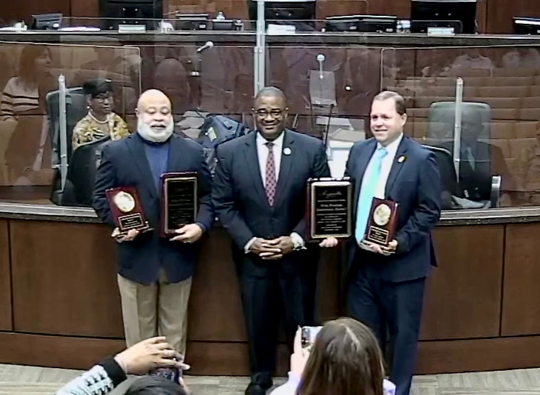 A good bye: The Augusta Commission said farewell Tuesday to members Bobby Williams, left, and Sean Frantom, right. Both leave office this year. Between them is Augusta Mayor Garnett Johnson.