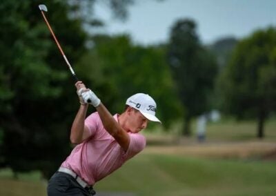 The Cayman Island's Justin Hastings (above) earned a share of the lead after a seven-under 65 on Friday. Photograph by LAAC.