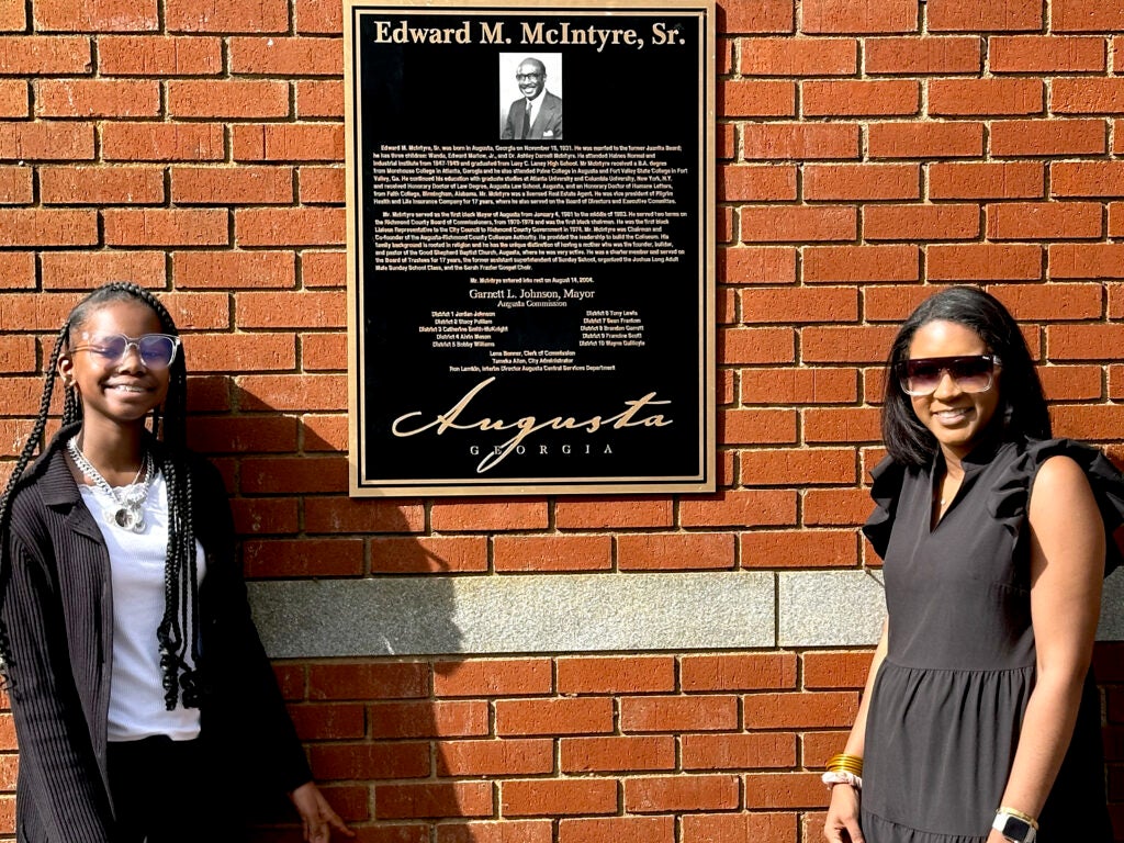 Plaques and signs mark the dedication of Augusta's Riverwalk to former Mayor Edward M. McIntyre Sr. Staff photo by Susan McCord