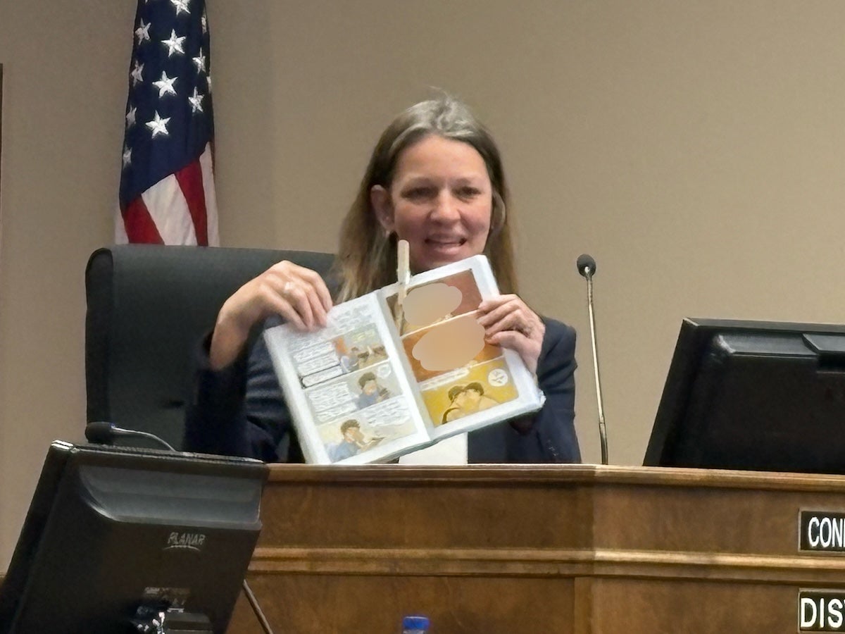 District 1 Commissioner Connie Melear held up a copy of the book "Gender Queer" and showed the images she thought were concerning in the book. The two images depict a sexual act. The Augusta Press has blurred these images to allow for publication. Staff photo by Stephanie Hill