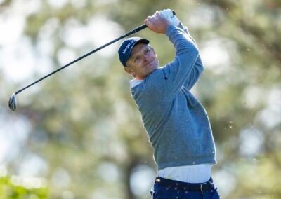 Justin Rose of England plays a stroke from the No. 4 tee during the second round of the Masters at Augusta National Golf Club, Friday, April 11, 2025.