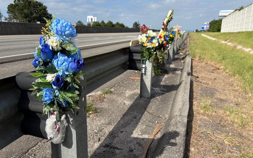 There is a memorial with flowers and crosses on I-20 westbound near exit 194 to honor fallen Deputy Brandon Sikes. Photo by Stephanie Hill