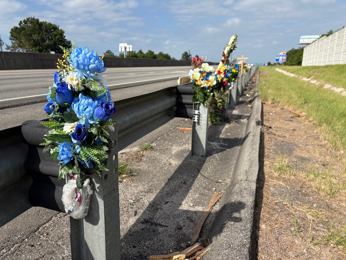 There is a memorial with flowers and crosses on I-20 westbound near exit 194 to honor fallen Deputy Brandon Sikes. Photo by Stephanie Hill