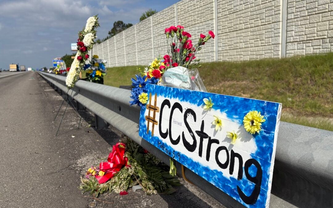 There is a memorial with flowers and crosses on I-20 westbound near exit 194 to honor fallen Deputy Brandon Sikes. Photo by Stephanie Hill