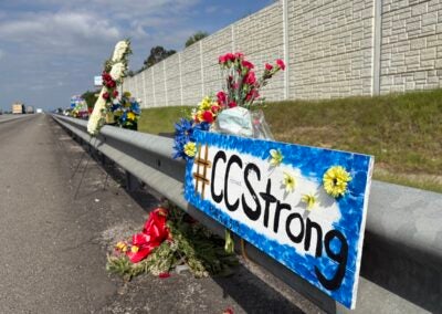 There is a memorial with flowers and crosses on I-20 westbound near exit 194 to honor fallen Deputy Brandon Sikes. Photo by Stephanie Hill