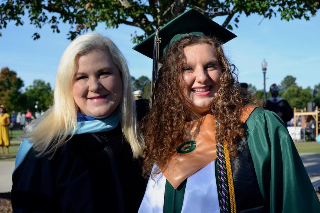 Greenbrier Elementary School 3rd grade teacher Allison Daley takes a moment with her daughter, Katie Grace, before the Greenbrier High School graduation. Staff photo by Stephanie Hill