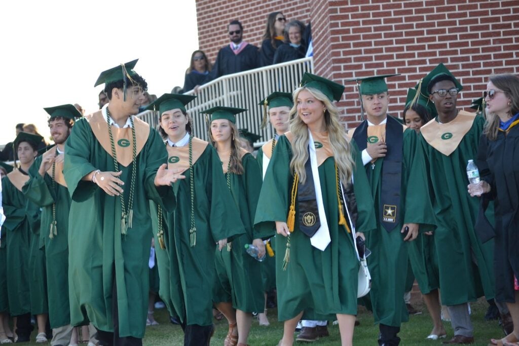 Graduates were all smiles as they walked into graduation. Staff photo by Stephanie Hill