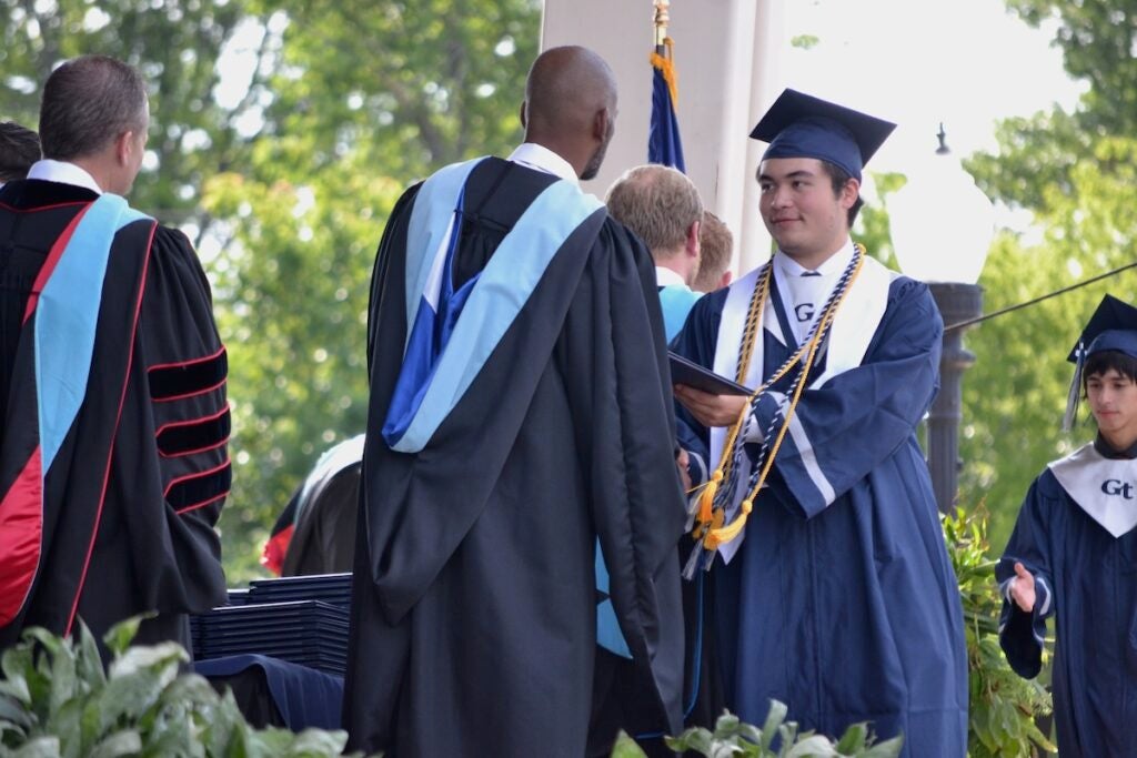 Grovetown High School salutatorian Johnathan Nelson Estrera Bertrand accepted his diploma at the commencement ceremony. Staff photo by Stephanie Hill