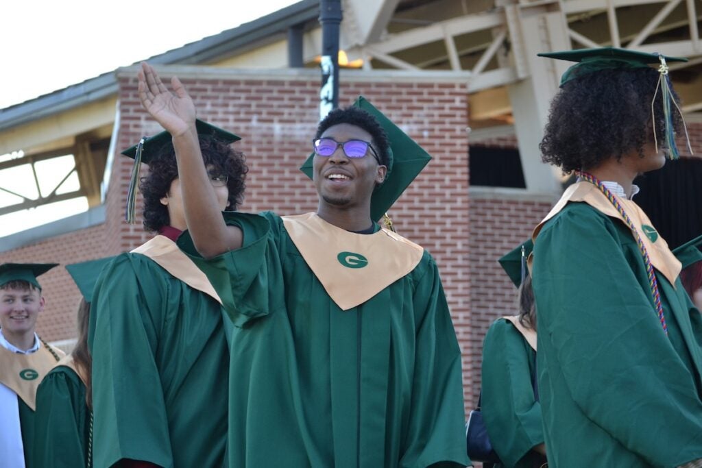 Graduates were all smiles as they walked into graduation. Staff photo by Stephanie Hill