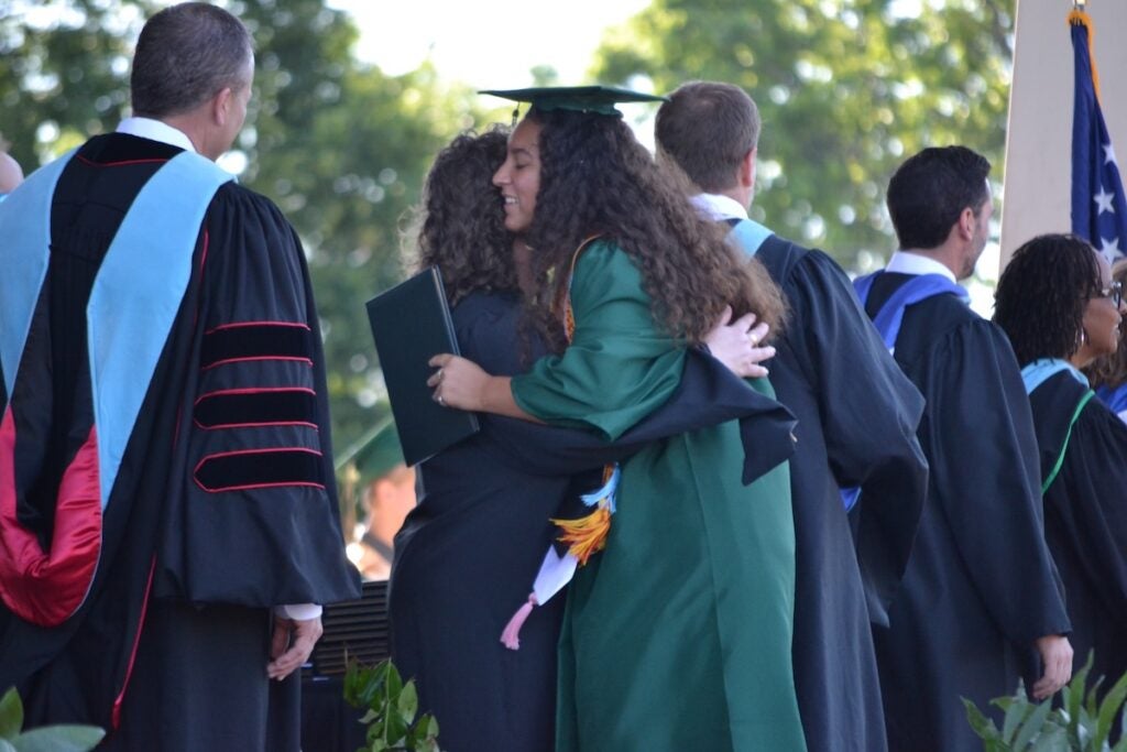 Greenbrier High School graduates shook hands and smiled while making their way across the stage to receive their diplomas. Staff photo by Stephanie Hill