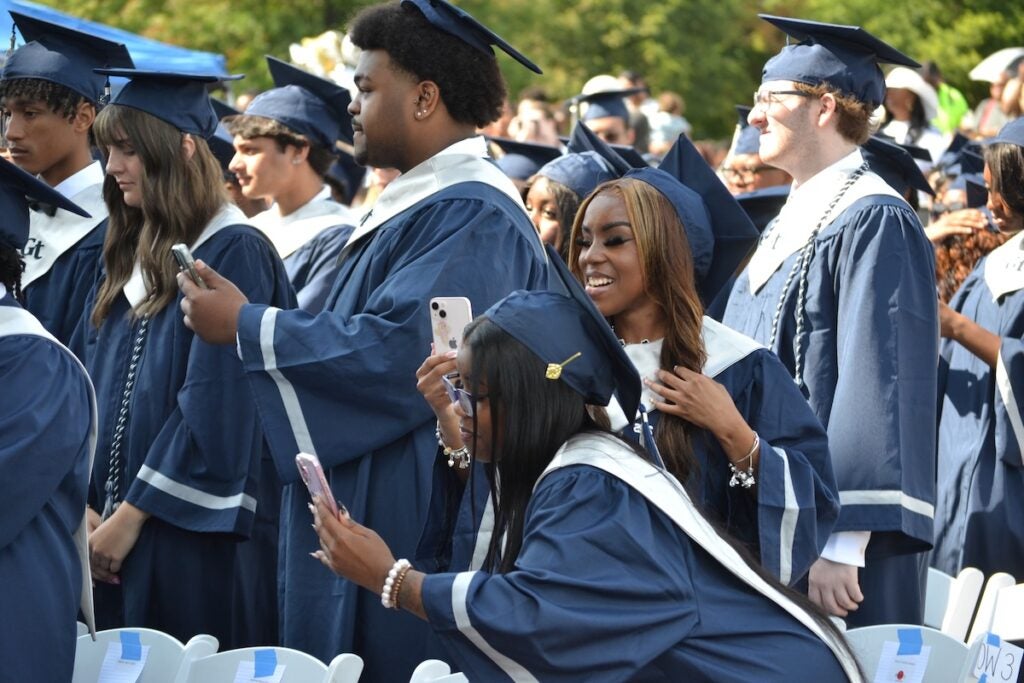Graduates took selfies with their diplomas following the Grovetown High School commencement ceremony. Staff photo by Stephanie Hill