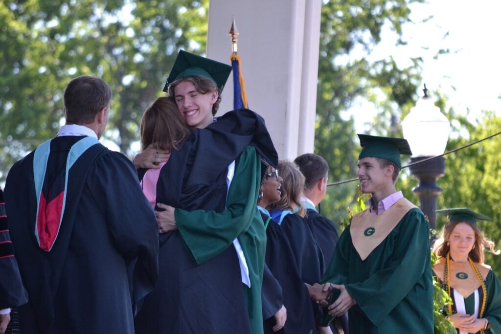 Greenbrier Elementary School music teacher Amy Toney hugs her son, Nolan, as he received his diploma. Staff photo by Stephanie Hill