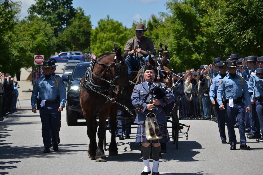 The body of Deputy Brandon Sikes was brought to the Performing Arts Center in a horse and carriage. Staff photo by Stephanie Hill