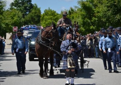 The body of Deputy Brandon Sikes was brought to the Performing Arts Center in a horse and carriage. Staff photo by Stephanie Hill