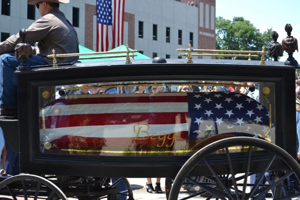 The body of Deputy Brandon Sikes was brought to the Performing Arts Center in a horse and carriage. Staff photo by Stephanie Hill