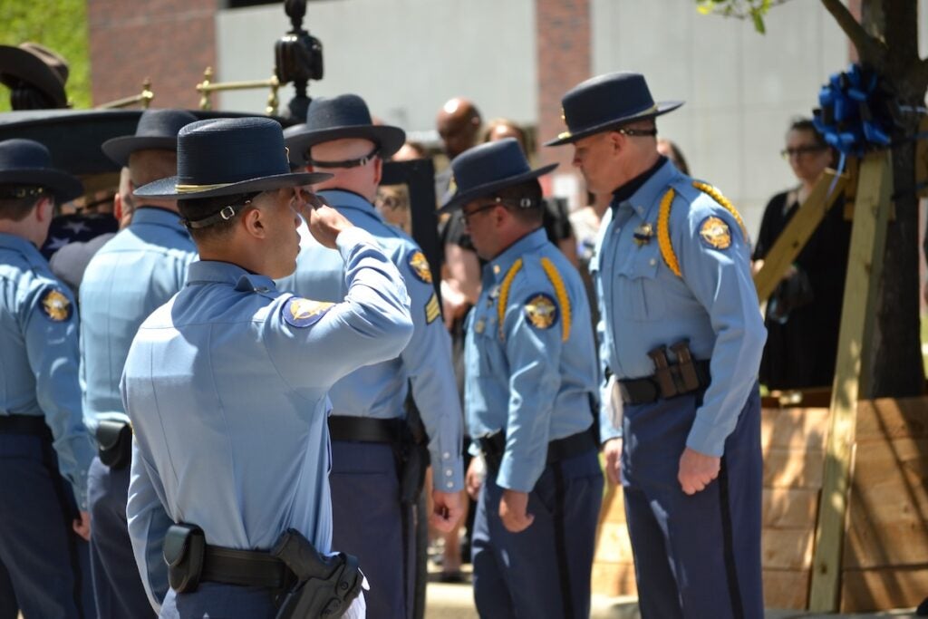 Deputies unload the body of Deputy Brandon Sikes. Staff photo by Stephanie Hill