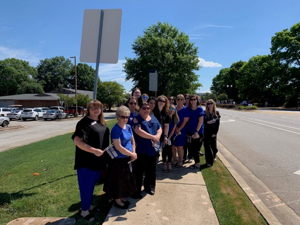 Employees of Columbia County Clerk of Court office lined up to pay their respects to Deputy Brandon Sikes. Staff photo by Scott Hudson
