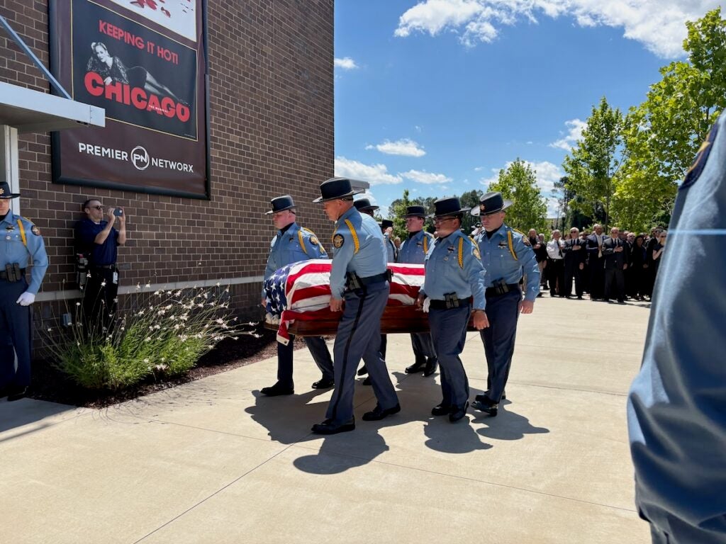 The casket of Deputy Brandon Sikes was carried into the Performing Arts Center by his fellow deputies. Staff photo by Stephanie Hill