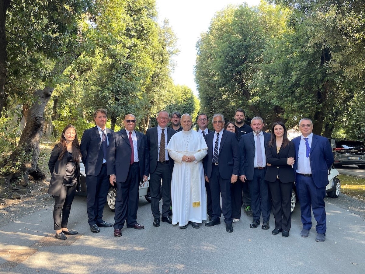 Pope Leo with representatives from Club Car and Exelentia, along with engineers and technicians who worked on the project. Photo courtesy Club Car