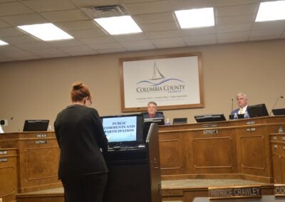 Karin Parham, CEO of the Freedom to Read Coalition of Columbia County, spoke at the Columbia County Board of Commissioners meeting on July 1 and asked the commissioners to rescind the library guidelines. Photo by Stephanie Hill