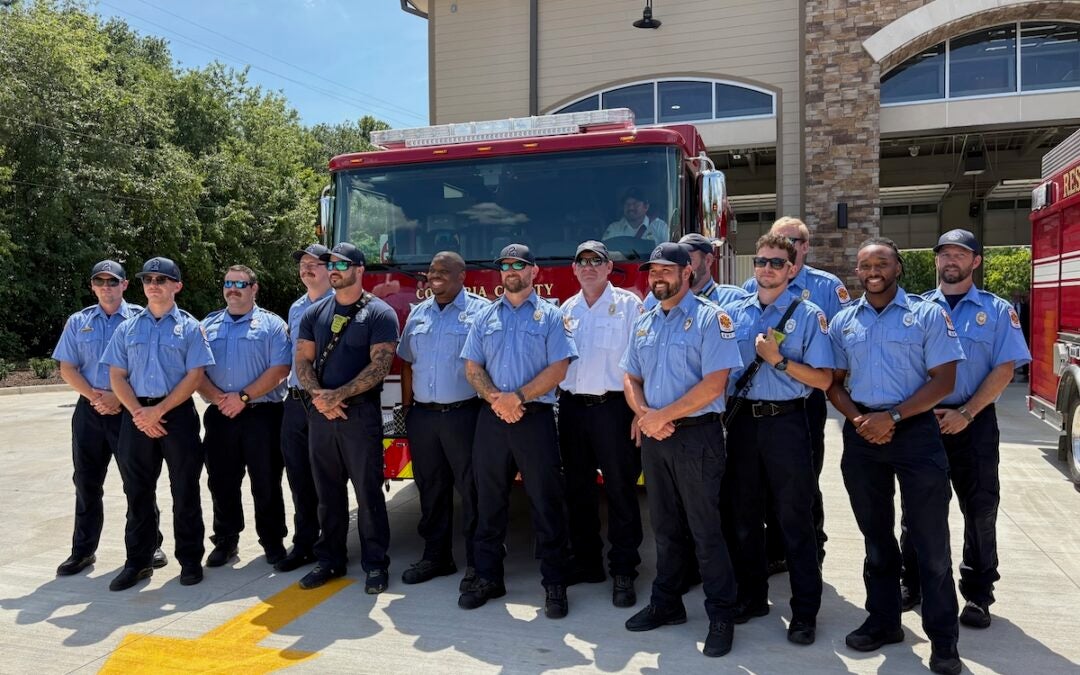 Personnel of Fire Station 2 take a moment to pose in front of the new rescue truck the station has. Staff photo by Stephanie Hill