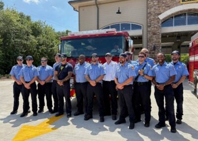 Personnel of Fire Station 2 take a moment to pose in front of the new rescue truck the station has. Staff photo by Stephanie Hill