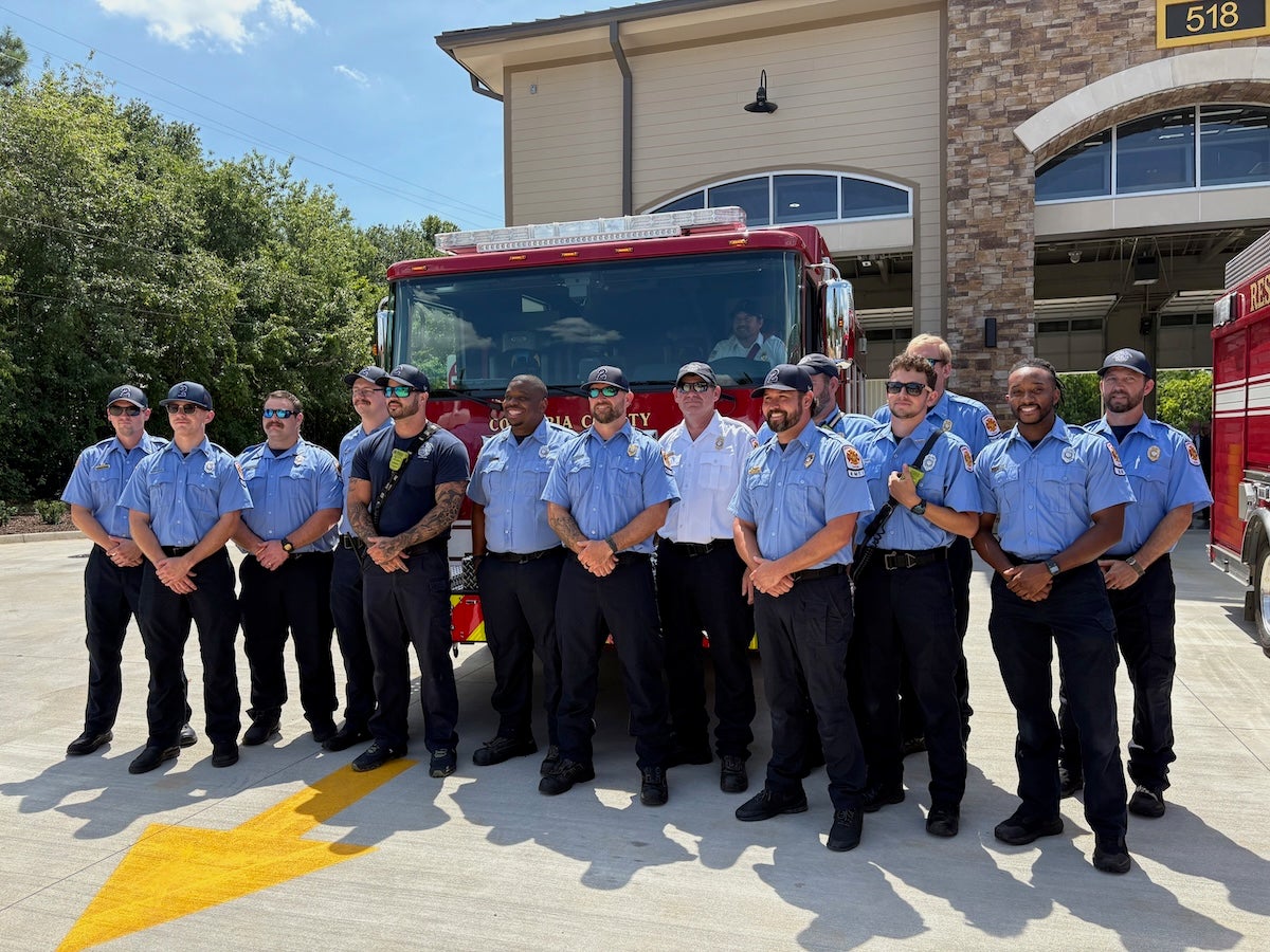 Personnel of Fire Station 2 take a moment to pose in front of the new rescue truck the station has. Staff photo by Stephanie Hill