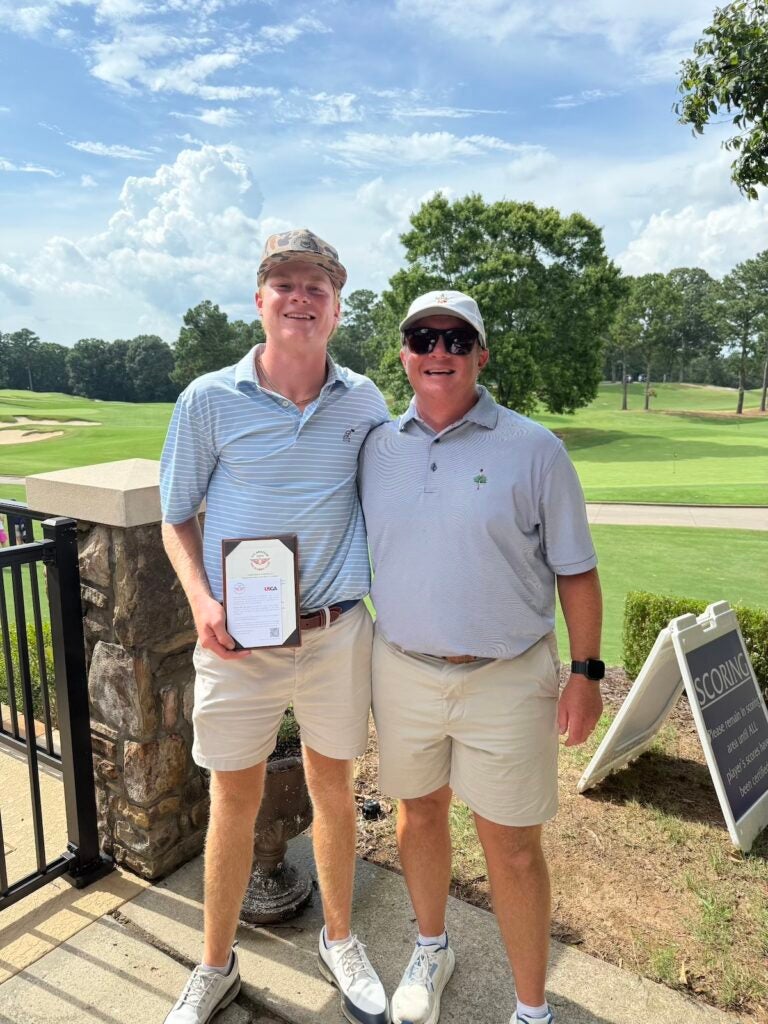 Walker Gantt, with his dad Patrick, holding his qualification ticket. Photo courtesy Walker Gantt