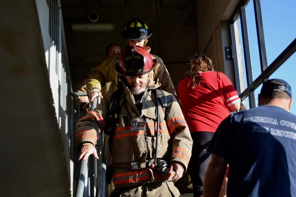 Evans High School students on the firefighter career pathway participated in the stair climb Thursday morning. Staff photo by Stephanie Hill