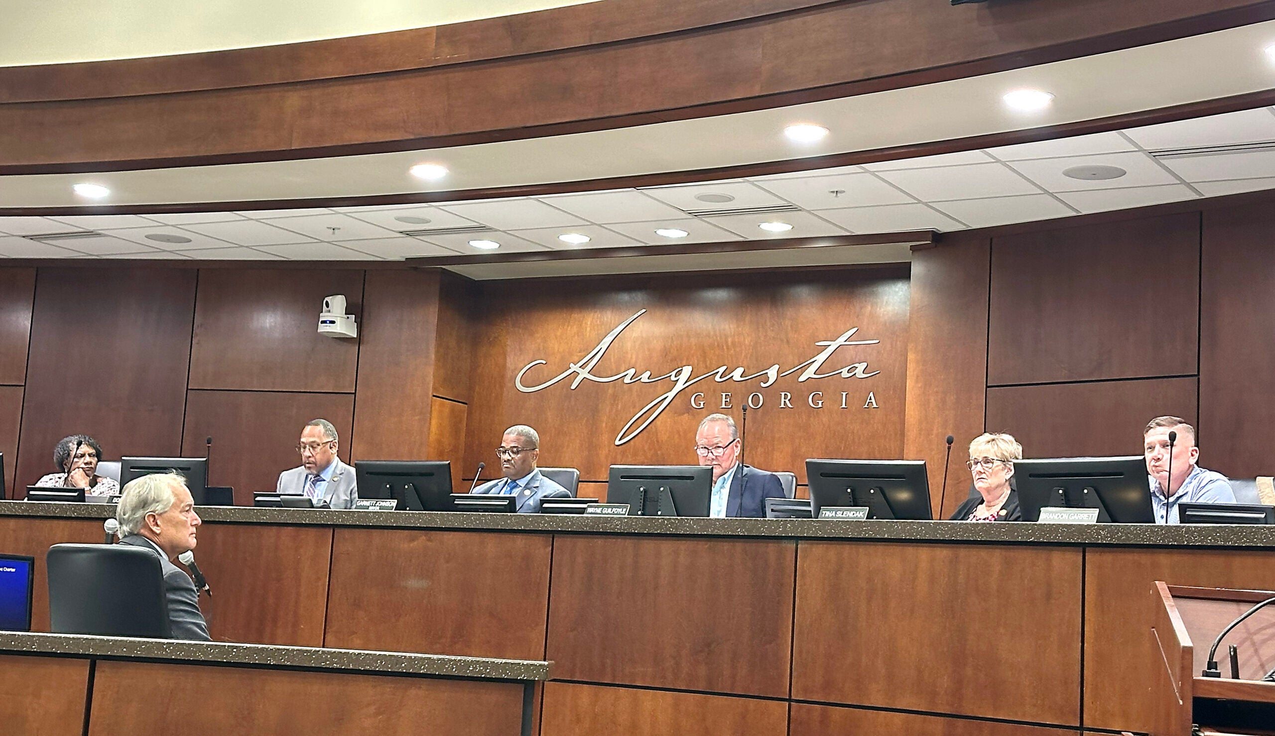 augusta commission sept 2 Interim General Counsel Jim Plunkett, lower left, speaks to Augusta commissioners and Mayor Garnett Johnson during Tuesday's meeting.