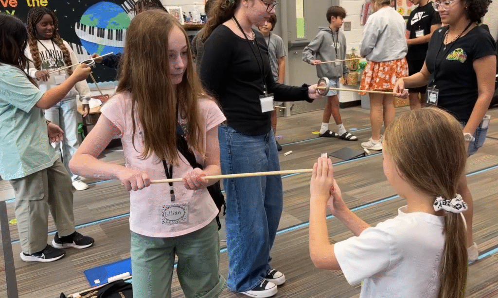 Beginning level students participate in a bow control exercise during their first practice in the Columbia County School District Strings Academy. Photo courtesy of Columbia County.