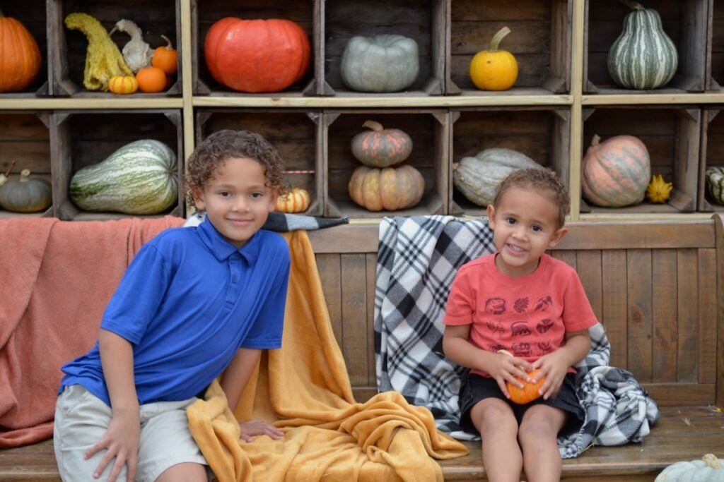 Jordan and Miles Quinones were all smiles at the pumpkin display at Good Earth. Staff photo by Stephanie Hill