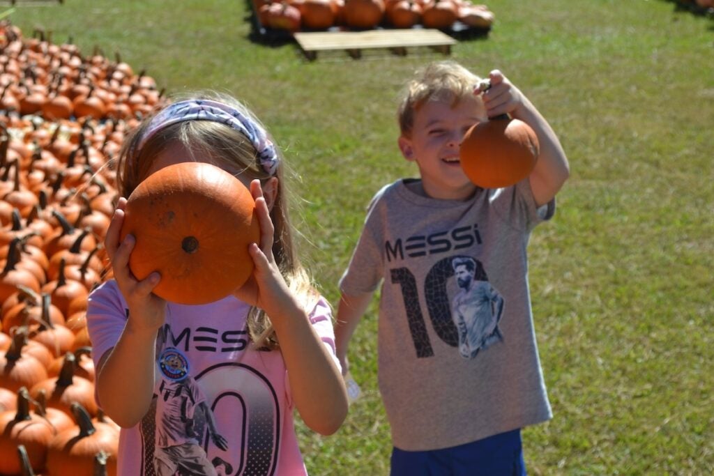 Charlotte and James Watson has fun looking at all the pumpkins at Marvin United Methodist Church.
