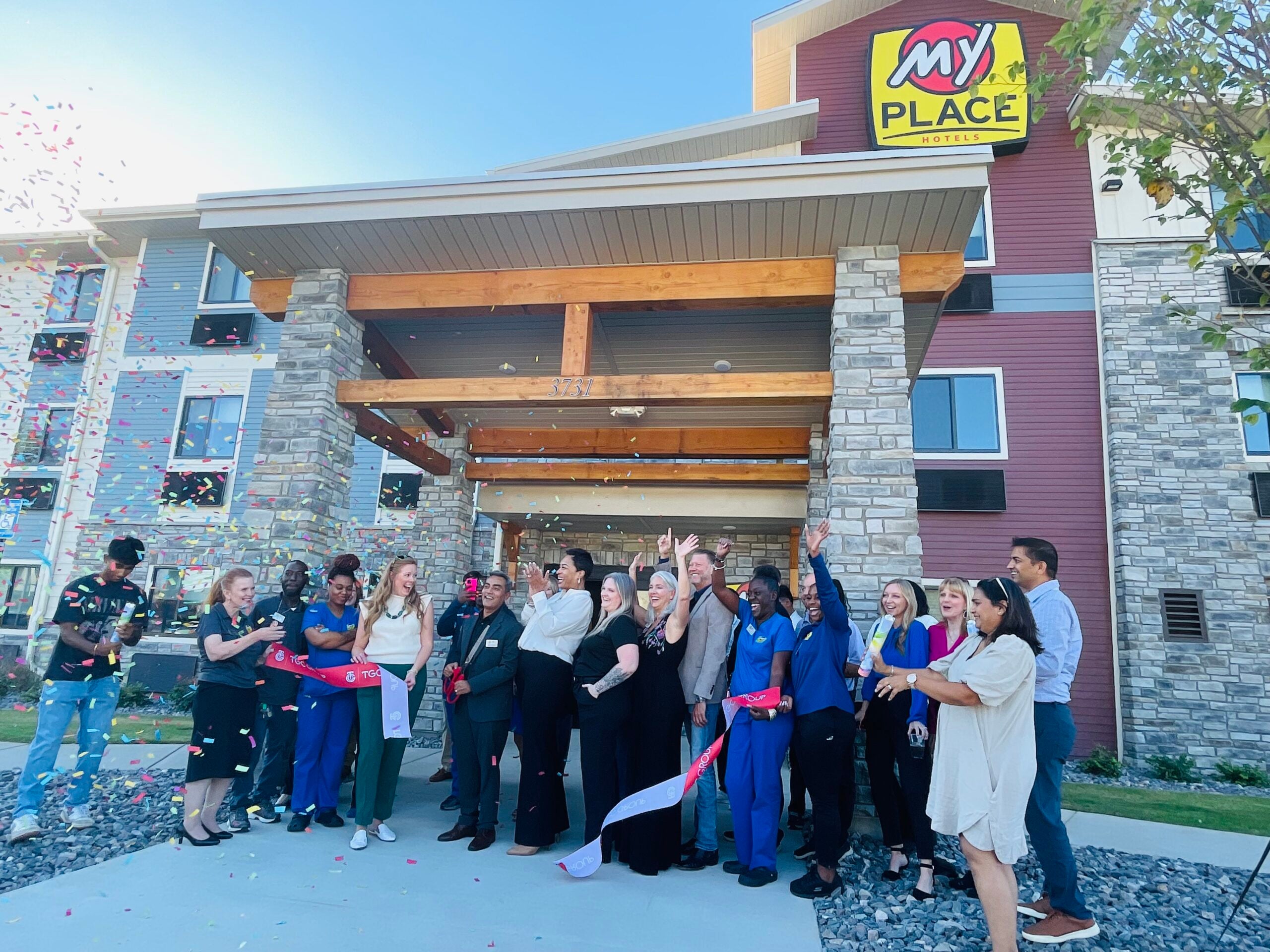 MyPlace Hotels ribbon cutting