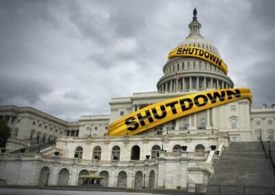 USA shutdown and United States government closed and american federal shut down due to spending bill disagreement between the left and the right pas a national finance symbol with yellow hazard tape in a 3D illustration style.