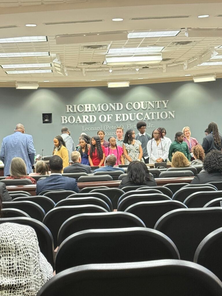 Members of the 2025-26 Superintendent’s Student Advisory Council prepare for a picture after being introduced during Tuesday’s meeting. Photo by Drew Wall.