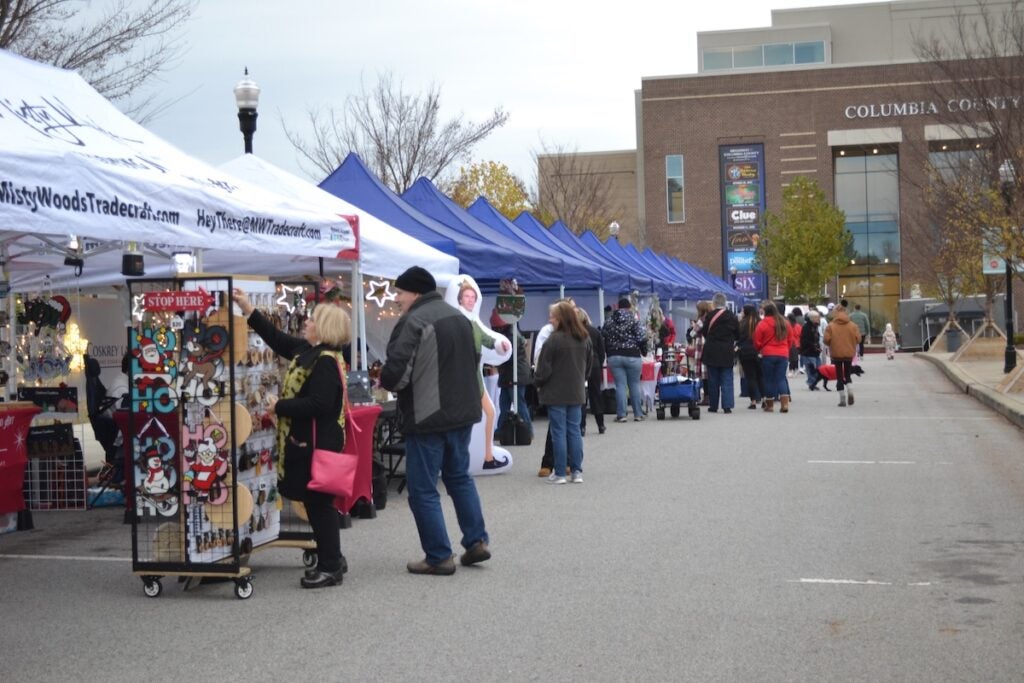 Community members browsed the different booths at the Christmas in Columbia County event on Thursday, Dec. 4. Staff photo by Stephanie Hill