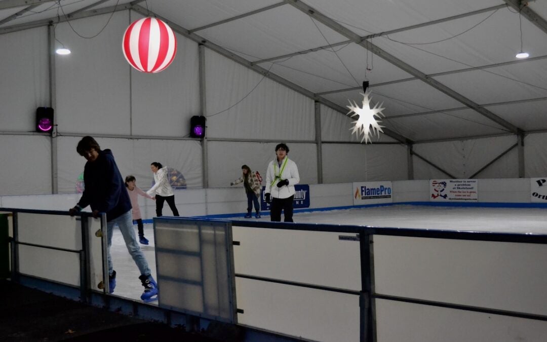 Patrons took to Evans on Ice prior to the Columbia County Christmas tree lighting. Staff photo by Stephanie Hill