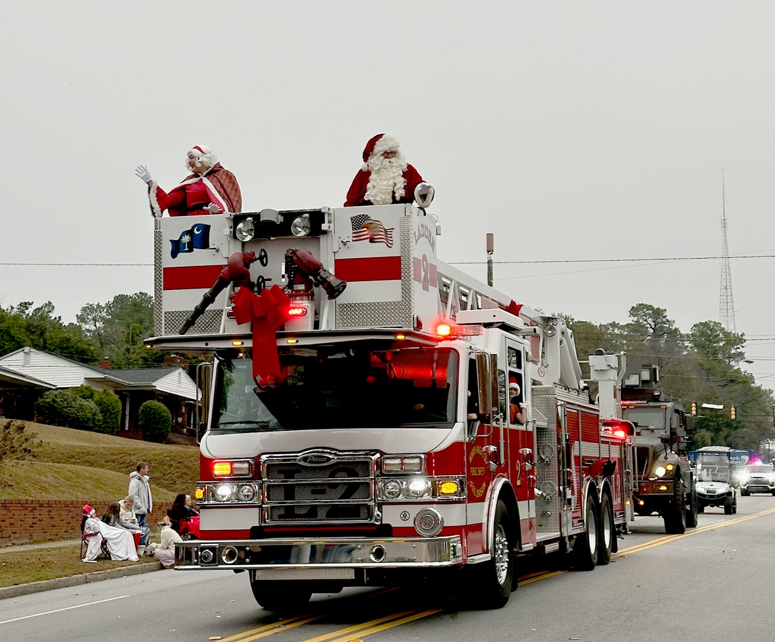 Mr. and Mrs. Claus rode atop a North Augusta Public Safety vehicle in the Christmas Parade Sunday. Staff photo by Susan McCord