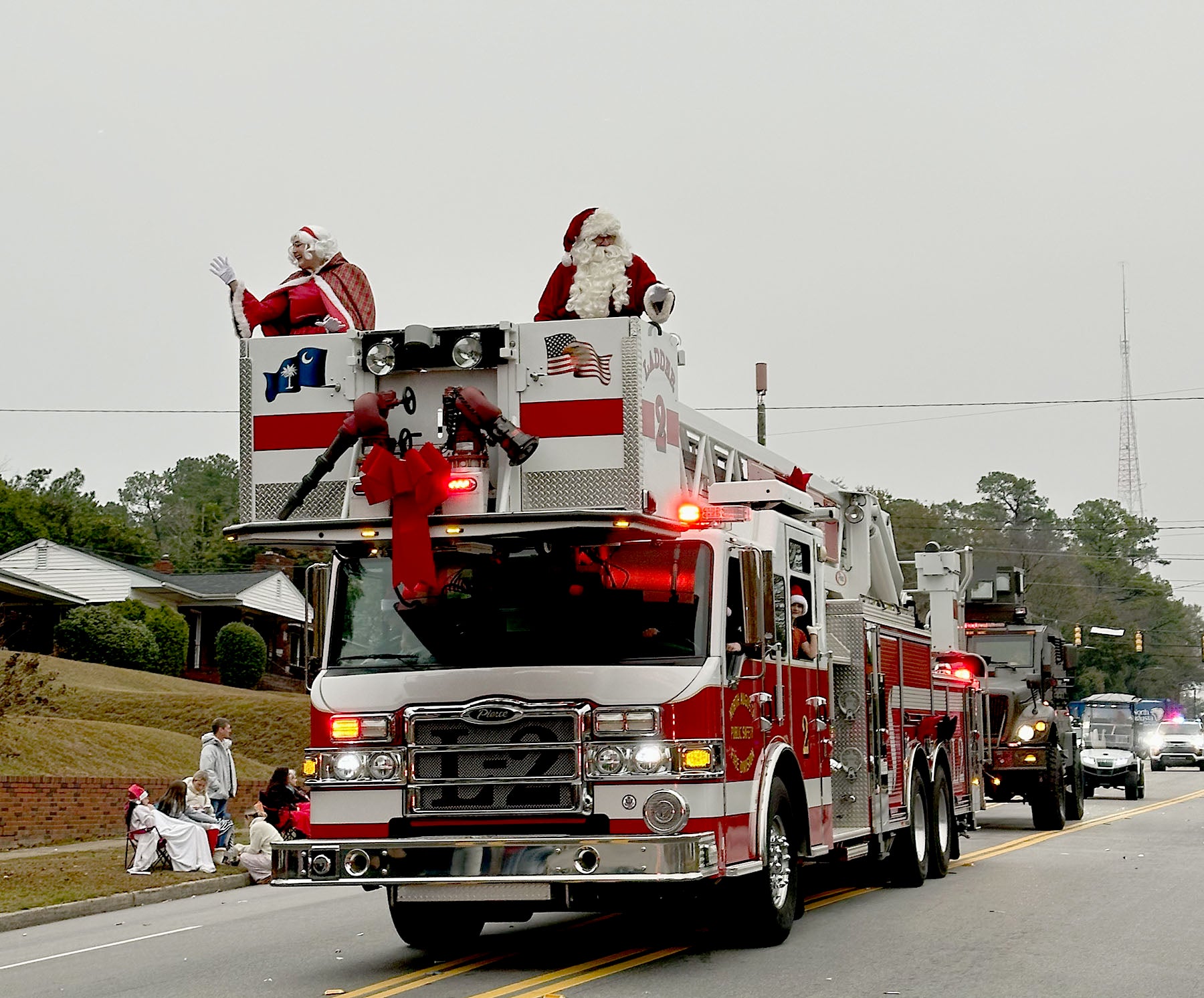 Mr. and Mrs. Claus rode atop a North Augusta Public Safety vehicle in the Christmas Parade Sunday. Staff photo by Susan McCord