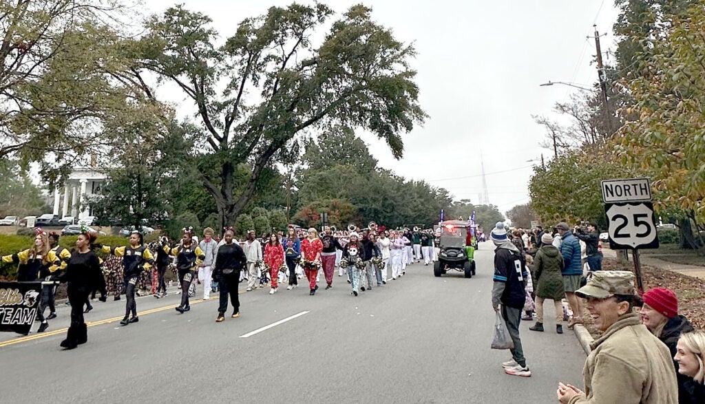 The North Augusta High School Band played "Sleigh Bells" in the North Augusta Christmas parade Sunday. Staff photo by Susan McCord