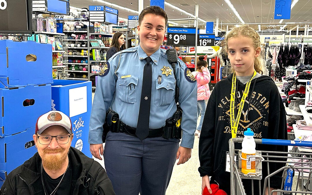 Columbia County Sheriff's Office "Day with a Deputy" saw area law enforcement take 50 kids shopping Tuesday. Staff photo by Susan McCord